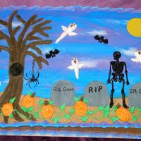 Halloween This is a 12"X15" single layer vanilla sheet cake tinted orange. Iced and decorated with butter cream. Dirt under tombstones is...