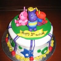 Backyardigans First Birthday Backyardigans cake for a little boy's first birthday. White cake with white buttercream frosting. All figures are gumpaster/fondant...