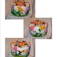 Springtime Birthday Cake... So, I got out of my comfort zone and tried a birthday cake for a friend with MMF and gumpaste and fondant flowers...she really likes bright...