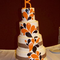 Paisley Splash Wedding 4", 6", 8", and 10" round tiers covered with buttercream frosting and fondant decorations. "K" was made with...