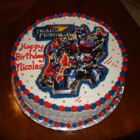 Transformer Cake Yellow cake, at the time could not get and edible image had to use a plate for top of cake. My friends kid said cooollllllllll when he saw...