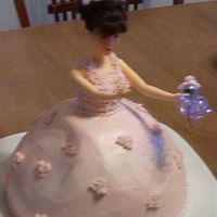 Barbie Cake For A 4 Year Old Vanilla cake with Strawberry filling and butter cream frosting. Pearl beads as accents along waist and bottom also in the center of the...