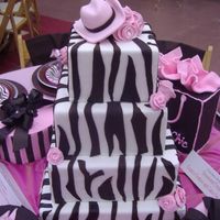 Zebra Cake This cake was the centerpiece for a table design luncheon. I got inspiration from some plates and napkins. The hat on top goes with the...