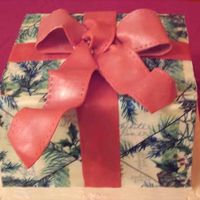 Package.jpg One of the goodies for last night's dessert party. White chocolate WASC cake frosted in buttercream. My first attempt at a "...