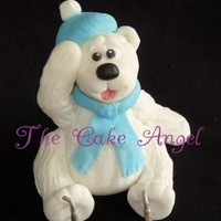 Poomagoo Made from modelling paste (fondant and CMC). This cutie was a topper made for a Christmas cake.