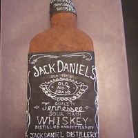 Jack Daniels Bottle This is covered in buttercream. The label is fondant and I hand wrote all the words on the label.