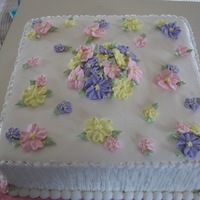 Floral Bridal Shower This cake was made for a bridal shower. It's a two-layer 12" square white almond sour cream cake with vanilla buttercream. The...