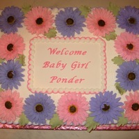 Gerber Daisy Baby Shower I made this cake for a co-worker's baby shower. The mom-to-be loves gerber daisies.The gerber daisies are gumpaste/fondant and the...