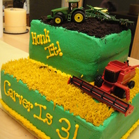 John Deere White cake, rasp filling and BC with oreos for the dirtTractor and combine are toys! My son Loved it!