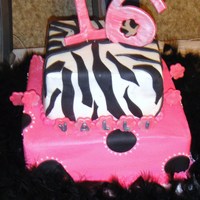 Sweet 16 Cake was white and pink swirled, with hot pink buttercream filling. All she wanted was pink, pink, everywhere! First time doing zebra...