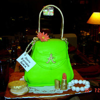 Fondant-Covered Purse Cake And Makeup I made this for my stepdaughter's 32nd birthday. It was my first purse cake. It is lemon cake with buttercream icing and covered in...