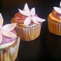 Sugar Flower Cupcakes Blueberry buttercream cupcakes. topped with a gumpaste flower.