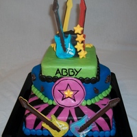 Rock Star Cake This cake was made for a 12 year old girls birthday. The base cake was Gluten Free, the middle layers were regular marble cake. The top...