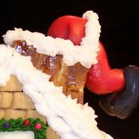 Christmas House Cake 2 Here's a close up of Santa's bottom, poor Santa. Maybe it's time for Santa to join that Health Club the wife has been...