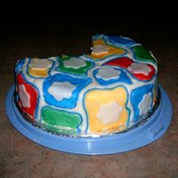 Practice 1 This is the first cake I covered in fondant. I painted the colors on with food coloring. It was fun :)