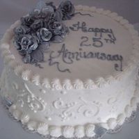 25Th Anniversary Cake WASC and buttercream cake with silver and white pearl dusted fondant roses. I made his cake for a neighbor who was driving 3 hours to...