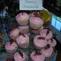 Cherry Cheesecake Cupcakes I made a white cupcake batter and mixed it with cherry pie filling, placed it in cupcake holders and topped it with a cheesecake batter. I...