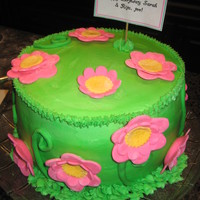 Flower Cake Pistachio Cake with pistachio cream filling. Buttercream frosting with fondant flowers. Cake for a spring surprise birthday party!