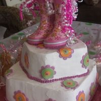 Baby Rain Boots Buttercream frosting with cut fondant flowers that matched the detail on the boots.