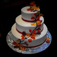 Autumn Leaves fondant/gumpaste leaves (some on wires) cascading down the 6-10-14 cake