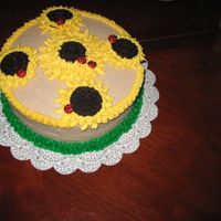 Sunflowers And Ladybugs Snickerdoodle Cake w/ Cinnamon BC. Sunflowers are made with oreos and Ladybugs are made with M&M's.