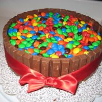 Sugar Shock A Father's Day cake for my CANDYHOLIC hubby. Devil's food, iced in choc fudge, covered in Kit Kats, topped w/ M&M's, all...