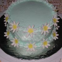 Daisy Cake Blue buttercream and Fondant daisys. Made for mother-in-law for Mother's Day.