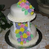 Wilton Iii Final Cake This is my final cake made in the Wilton 3 class. I had a wonderful instructer.Fondant roses, Buttercream boarders. Roses are on toothpicks...