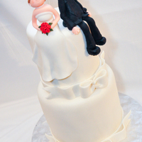 You And Me.... Personalized sculpture of the bride and groom sitting on double barrel cake. Lots and lots of luster dust!!! Very simple... but yet I love...