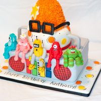 Yo Gabba Gabba I made this for my nephew's birthday. Bottom tier is the boom box with hand sculpted figures sitting on the edge. The hat is rice...