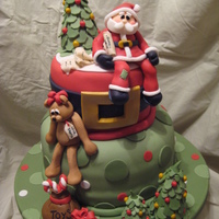 Santa's Jolly Ho-Ho-Ho!!! Happy Ho-Ho-Holidays!!! Sculpted Santa with list of "good kids" sits on top of the cake. Trees made from layers of snowflake...