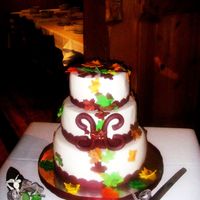 Fall Leaves This is a 6;,8;10', round covered in white fondant with a burgandy fondant ribbon,and a Fondant H. Than I covered it withwith fondant...