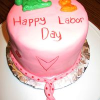 Labor Day Cake 6in white velvet butter cake, no filling, covered in pink fondant and decorated with a dragon and kitten fondant mold and food color...