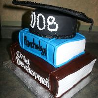 Graduation Books This cake was for a university graduate. Top book is strawberry shortcake and the bottom book is chocolate fudge cake. The graduation hat...