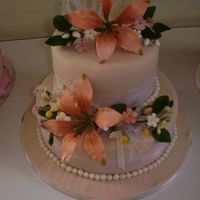 Class Cake - Last Class March 29, 2008 (Second Gumpaste Flowers) Two tiered cake (top White chocolate mud cake and bottom coconut cream cake). Coveredwith buttercream and covered with brown coloured...