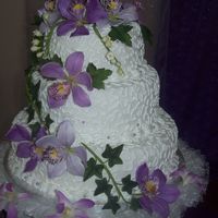 Gumpaste Cymbidiums Cymbidiums I made for a cake decorator who usually uses real flowers. There are at least 3 real orchids at the base of the cake. When she...