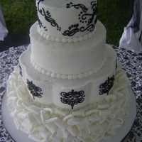 Black And White black and white ruffle cake buttercream based with fondant folds as a base