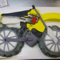 Dirt Bike Racing multiple cake shaped into the Dirt bike Cake for a little girl