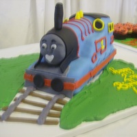 Thomas The Train traditional carved Thomas the train with the tracks laid out