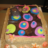 Life's A Beach! Everything is edible. The sun glasses and blackberry are fondant, sea shells are chocolate and the sand is brown sugar and cookies