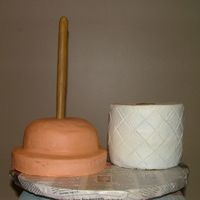 Plunger And Paper This was for my BIL who is a plumber. The handle was made from butterscotch candies.