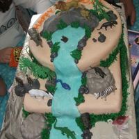 L_D21908F8F01C43709E6386467Adb.jpg jungle themed b-day cake for my nephew and niece's combined b-days.....