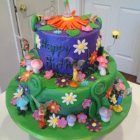 Tinkerbell Birthday This is a busy birthday cake for a 5-year-old little girl. It's vanilla with strawberry filling! Yum!