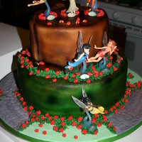 Tinkerbell And Fairies Tink and her friends on a tree stump!