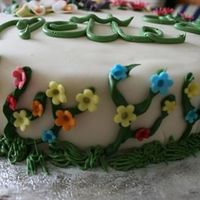 A Side View Of The Cake I had all these flowers climbing up the side of the cake.