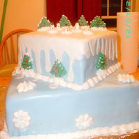 Winter Wonderland This is the first cake I've used fondant on. The Christmas trees and Snowflakes are royal icing and the snowmen are fondant.