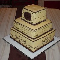 Champagne And Brown Wedding Cake With Monogram Fondant Decoration On Top 