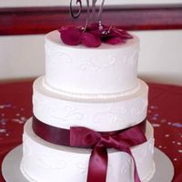 Simple Wedding Cake Round Buttercream wedding cake, with satin ribbon and bow.