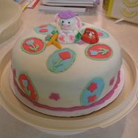 Easter Cake W/ Fondant Bunny This is my 2nd fondant cake. White cake with buttercream icing and covered in fondant. Fondant Bunny, basket, and carrots.