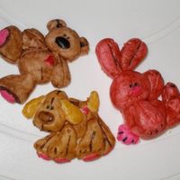 Bunny, Dog & Bear Just practicing with gumpaste. These were made from Sculpey mold and then painted with americolors and outlined with edible markers.
